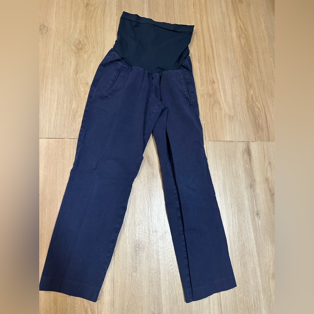 Navy blue work pants with pockets, over the belly